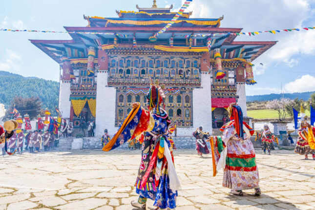 Colorful Bhutan festival with dragon masks