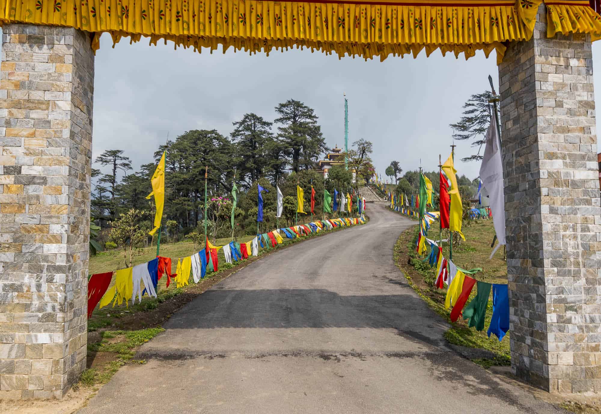 Long road in Bhutan leading to a temple