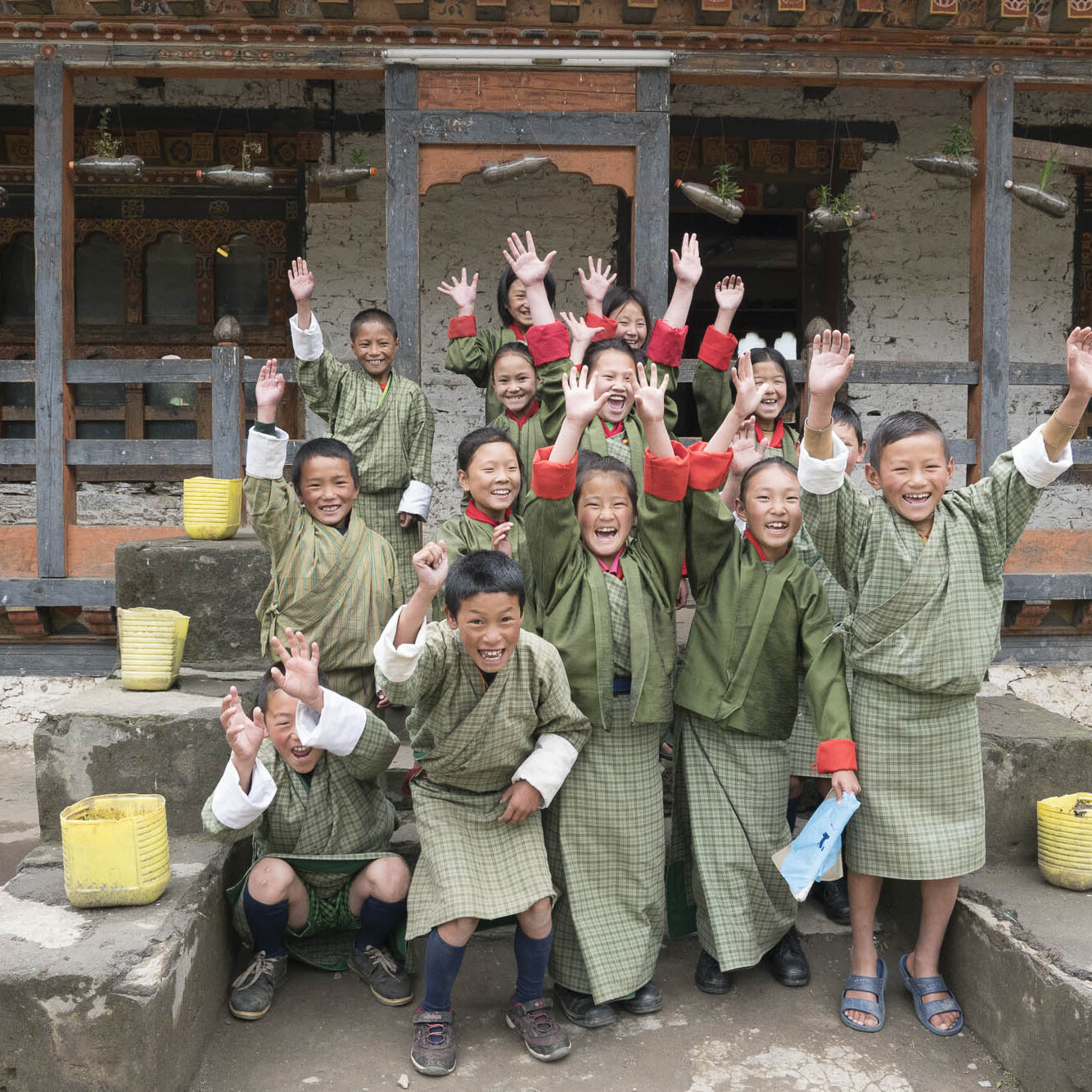 Bhutanese school children cheer with joy